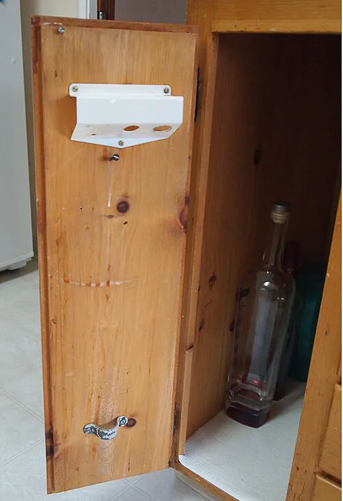 vintage-kitchen-tool-in-knotty-pine-kitchen-3 knotty pine kitchen with weird holder