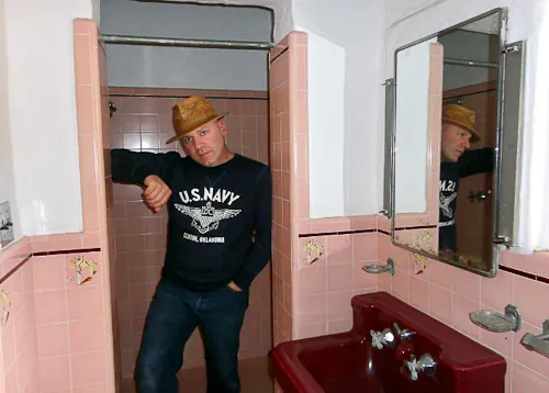 thommy in one of the pink bathrooms in the leo carrillo ranch