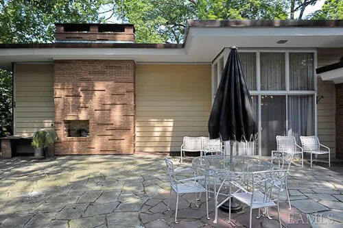 1960-house-with-built-in-outdoor-fireplace midcentury modern outdoor fireplace