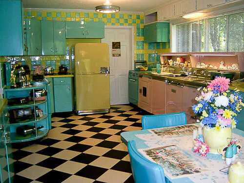 blue yellow and pink kitchen with black and white checkerboard floors