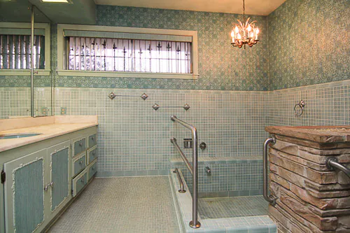 bathroom with tiled sunken tub