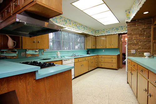 wonderful 1950s wood kitchen with blue countertops and wallpaper