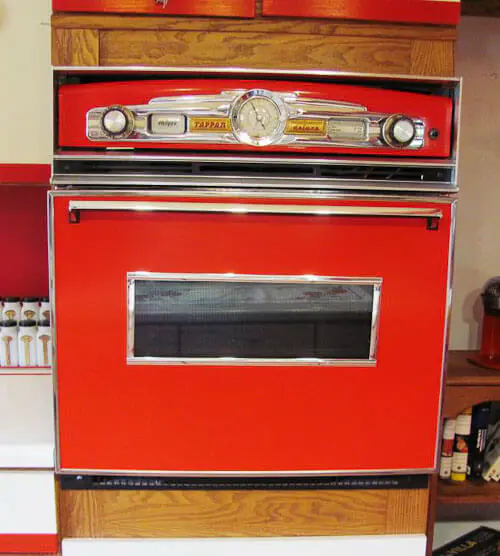 a built in oven painted red and converted to look retro