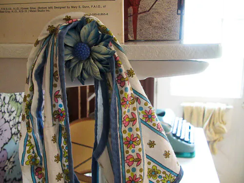 curtain-tie-back-used-as-hook vintage curtain tie back used as apron hook