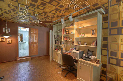 Fantastic 1960 time capsule house featured on RetroRenovation.com mylar wallpaper on the walls and ceiling of a bedroom