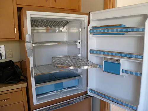 inside of a 1962 GE refrigerator with swing out shelves