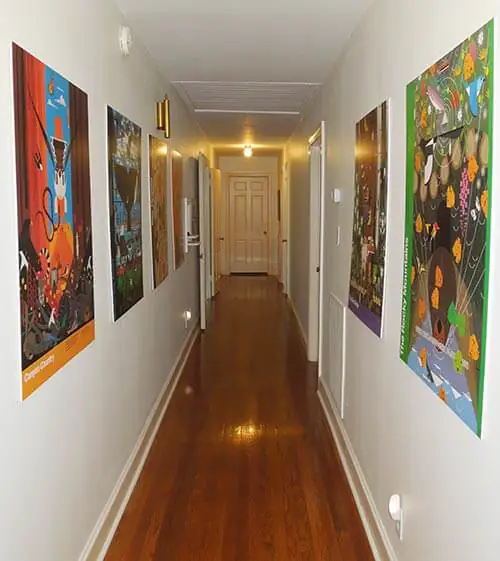 Charlie-Harper-posters-in-hallway