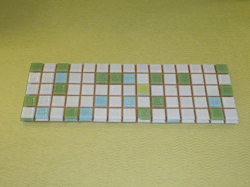 vintage-mosaic-tile-on-green-counter