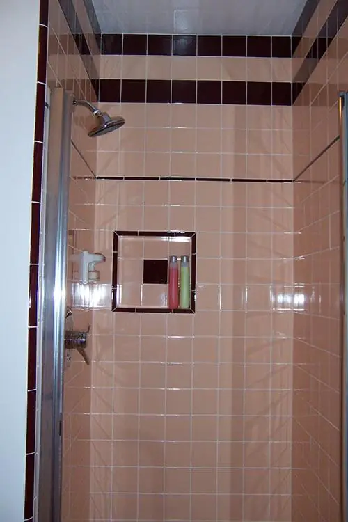 mid-century-shower-tiled-with-B&W-tile-peach