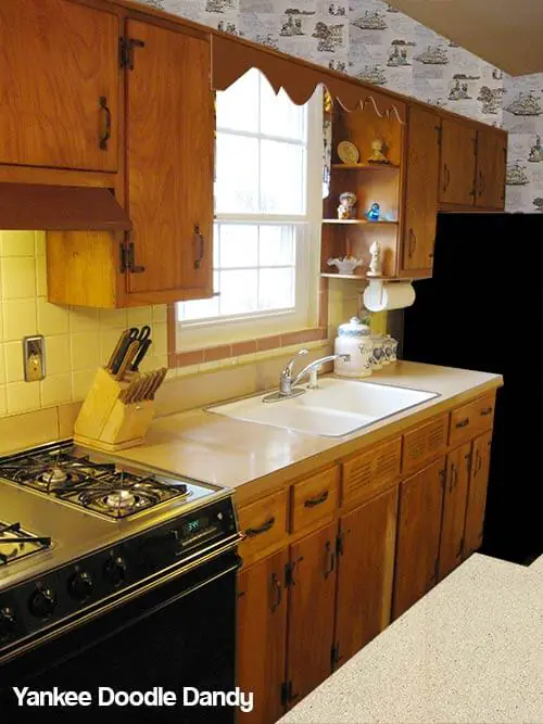 Mid century kitchen with wallpaper and original tile