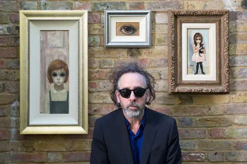 Tim Burton with his vintage Margaret Keane paintings, October 28, 2014. © 2014 The Weinstein Company. All rights reserved.