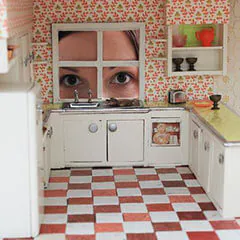 looking in dollhouse window