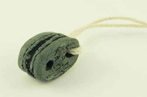 tiki pendant