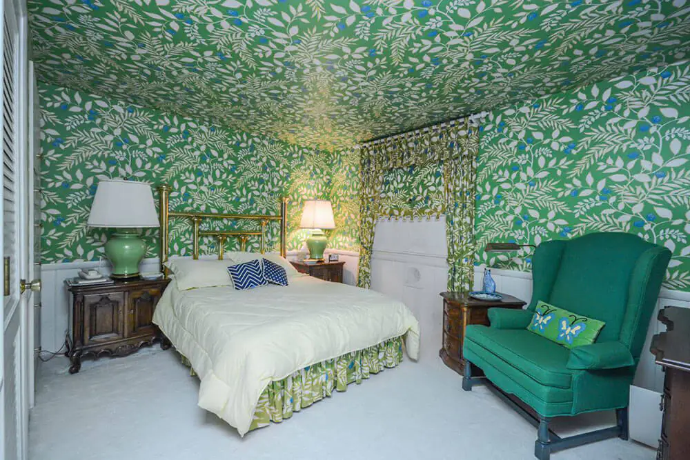 bedroom with wallpaper on the ceiling