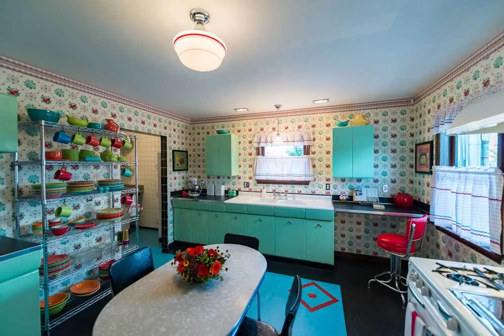 cheerful retro kitchen with bradbury wallpaper and aqua cabinets
