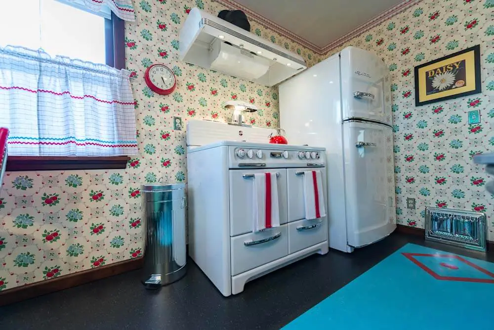 vintage westwood stove and big chill refrigerator in remodeled kitchen