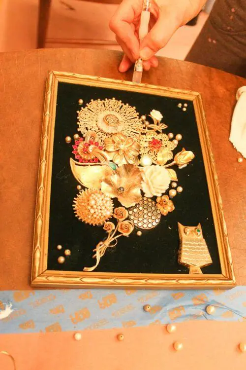 frame for art made from costume jewelry