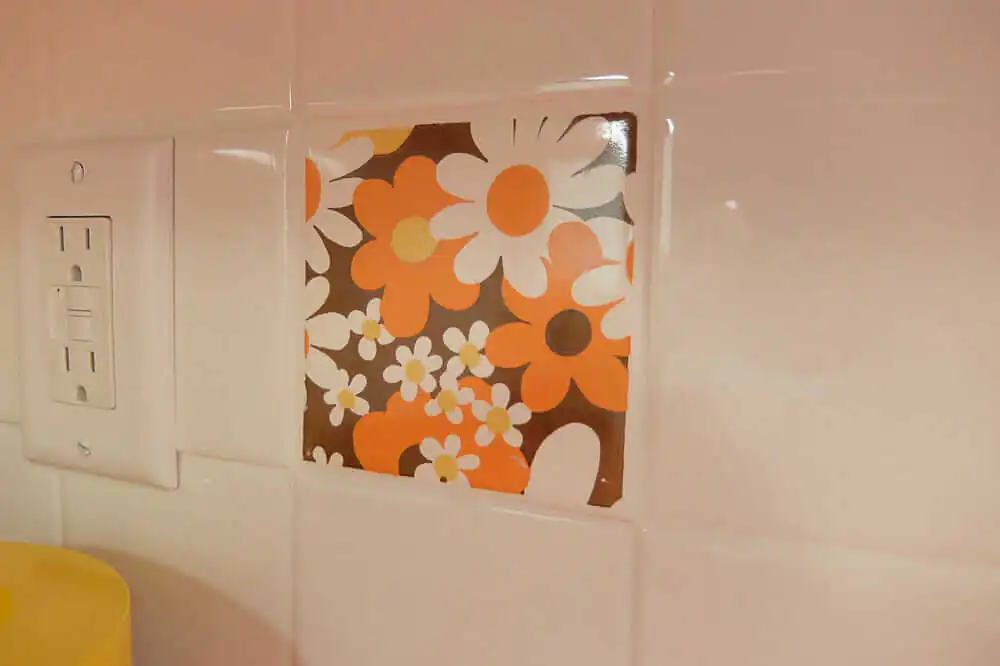 vintage trivets used as wall tile
